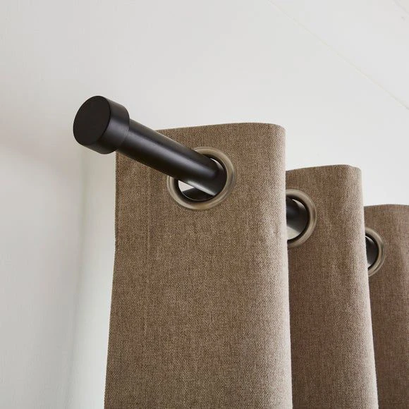 curtain styles 2026 featuring matte black curtain rod with grommet curtains