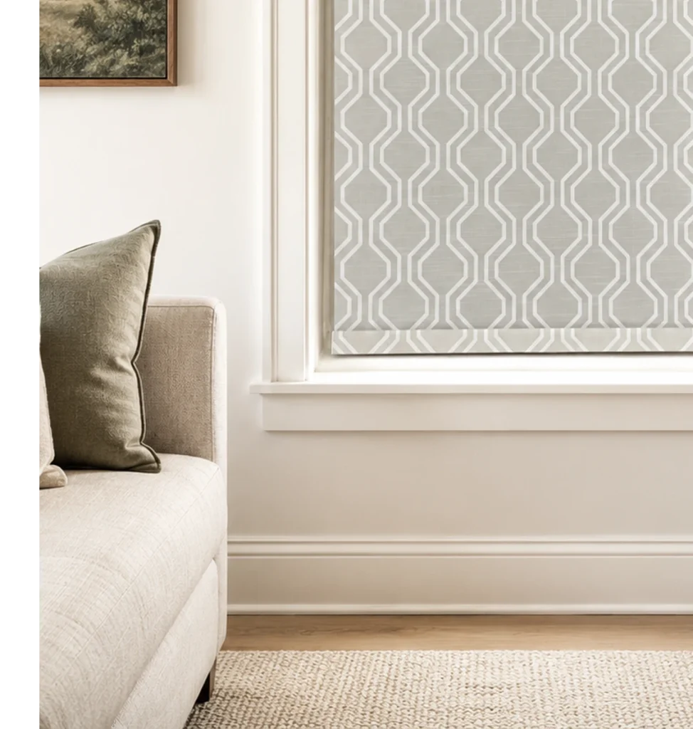 No-drill waterproof roller shades with a geometric pattern in a neutral living room